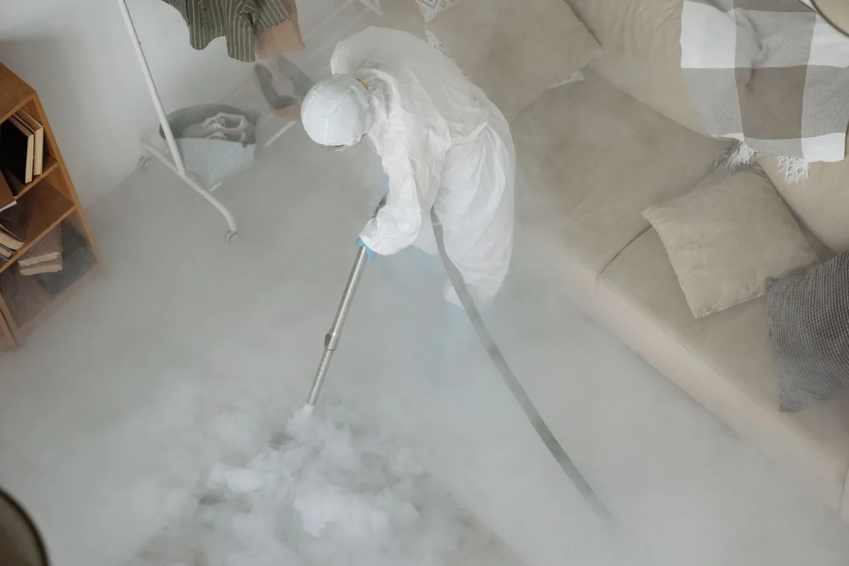 Biohazard cleanup technician in protective equipment, Cleary, MS